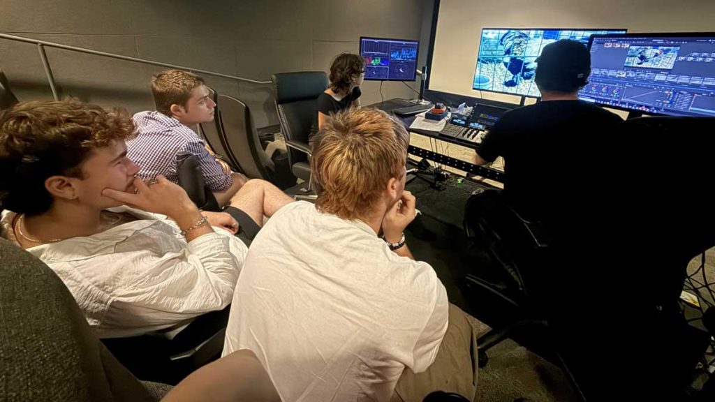 Five students work on post-production editing